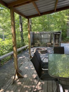 Patio with fire place - cabin is stocked with wood for sale